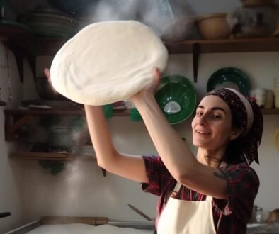 Italian_woman_spinning_pizza_dough_in_the_air